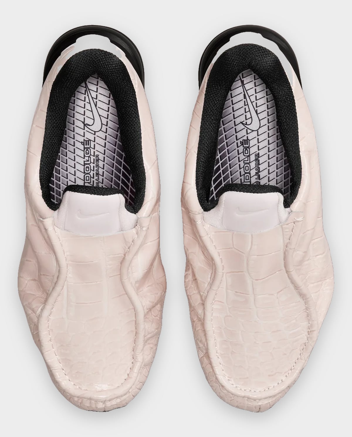 Top-down view of pair, pale pink croc uppers, black collars, patterned insoles, Pearl Pink