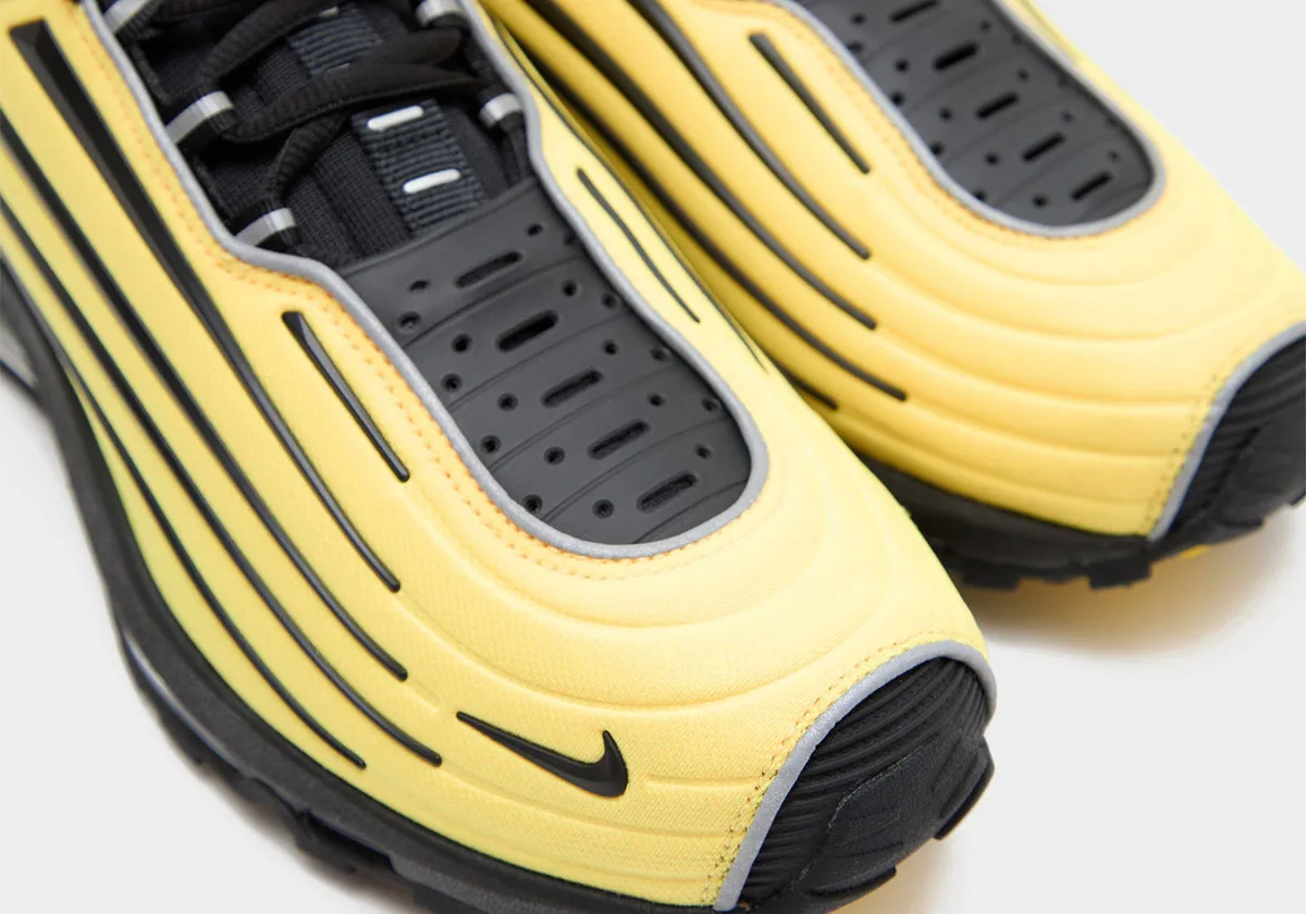 Toe detail of pair, ridged yellow panels, perforated black toe cage and black swoosh, Citron