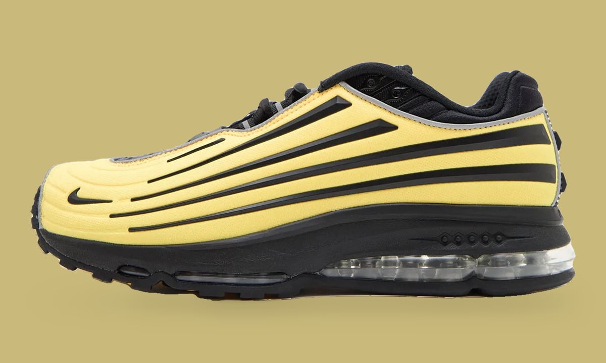 Lateral view of yellow shoe with black stripes, black midsole and clear heel air unit, Citron