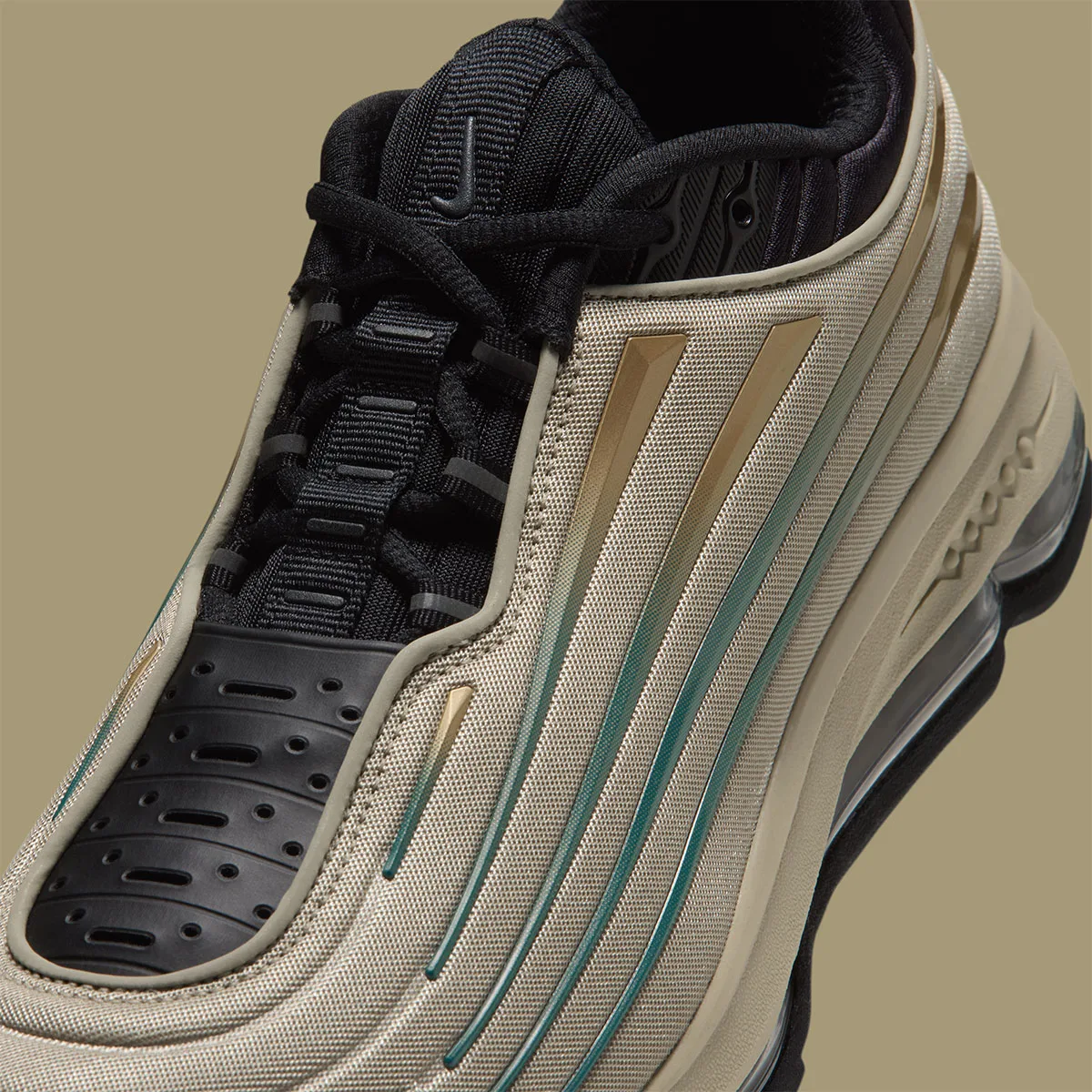 Detail of forefoot and lacing, black laces and perforated toe cap, gold and teal gradient stripes, Desert Khaki