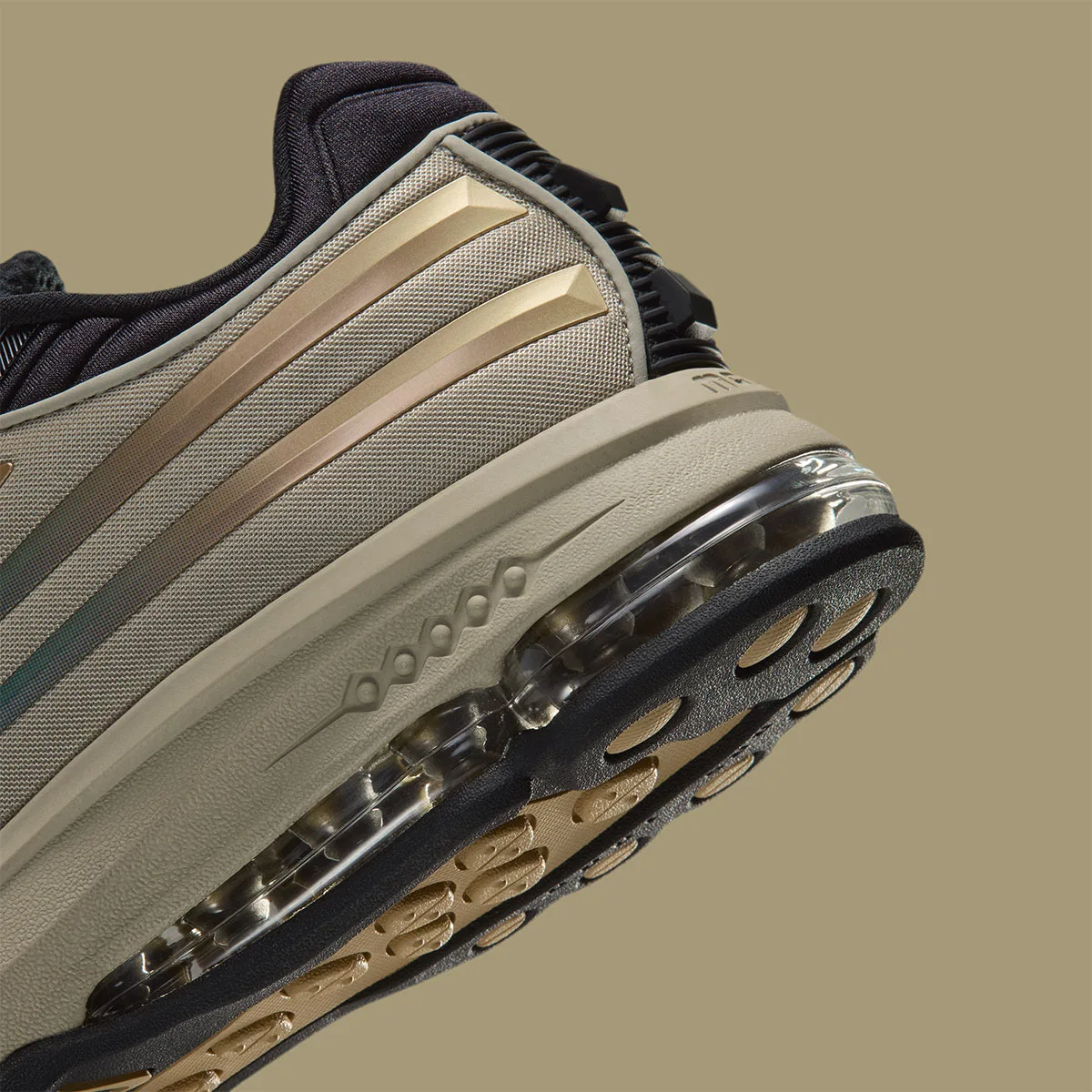Close-up of heel from the side, gold stripes, clear Air unit and tan outsole lugs, Desert Khaki