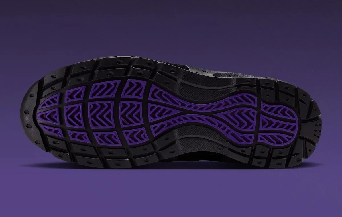 Outsole view with purple chevron tread pattern inside black rubber lugs, Eggplant