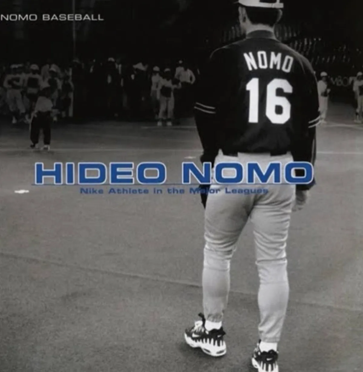 Black and white photo of a baseball player from behind, NOMO 16 jersey, Hideo Nomo text, Varsity Red