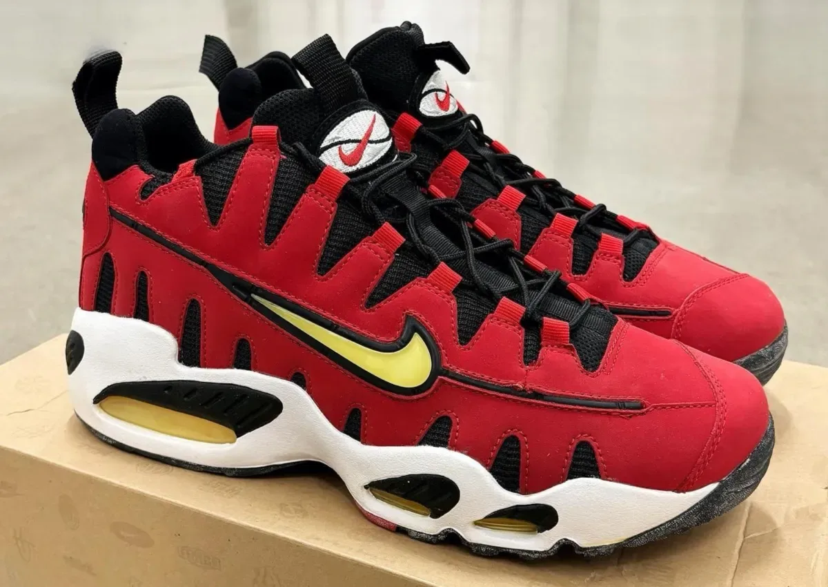Lateral pair on a box, red nubuck with black mesh, yellow swoosh and yellow air units, Varsity Red