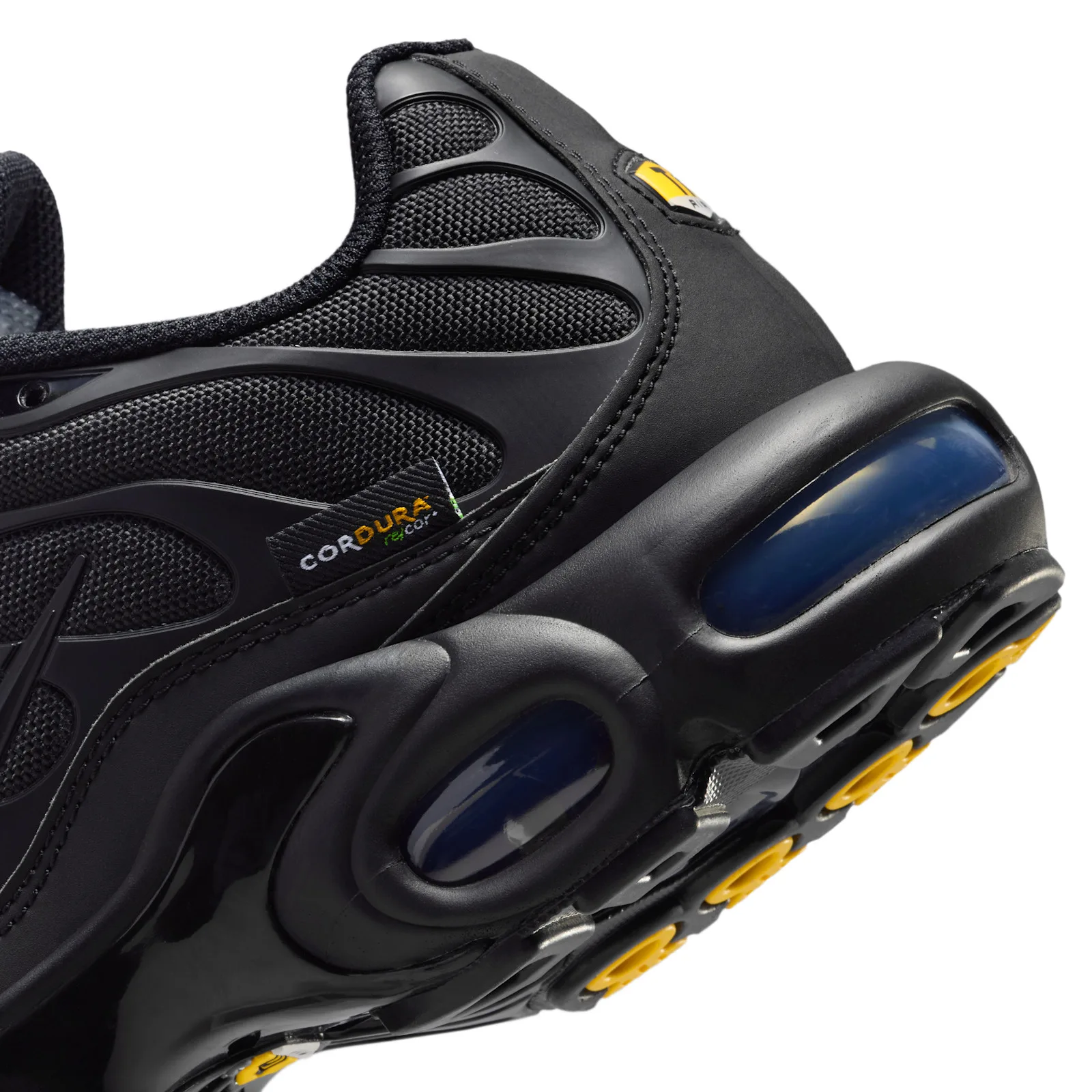 Detail of heel, Cordura tag, navy air bubbles and yellow outsole pods on black upper, Max Plus Cordura
