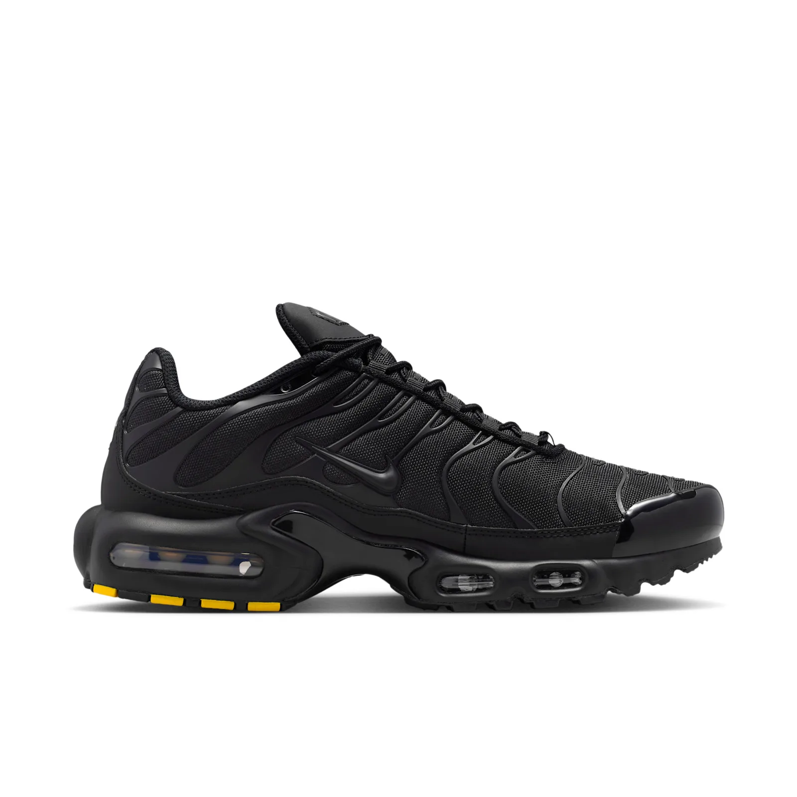 Medial view on white, all-black upper with yellow outsole segments under the heel, Max Plus Cordura