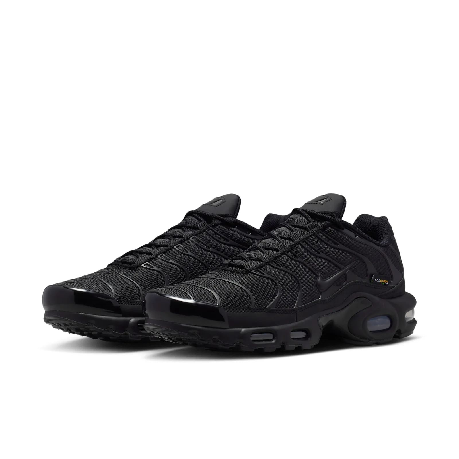 Pair at three-quarter angle on white, all-black woven uppers and glossy toe caps, Max Plus Cordura