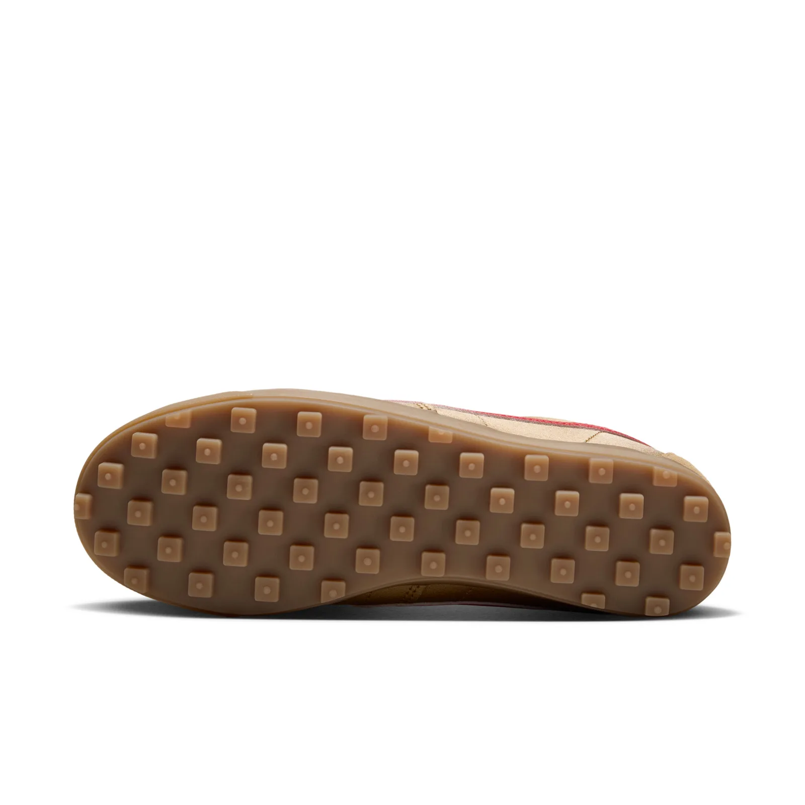 Outsole view showing a gum rubber sole with square studs, each with a small dot, NFL Pack