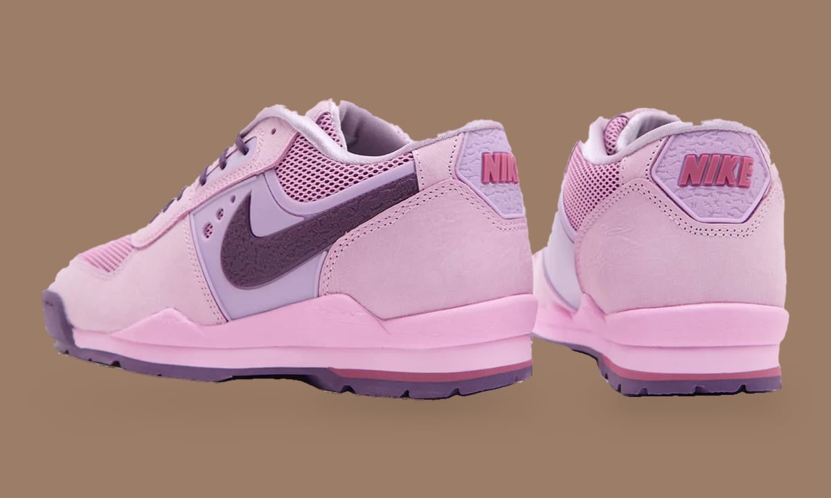 Heel and rear-quarter view of pink pair, NIKE on lilac heel tabs, Nike Baltoro Low