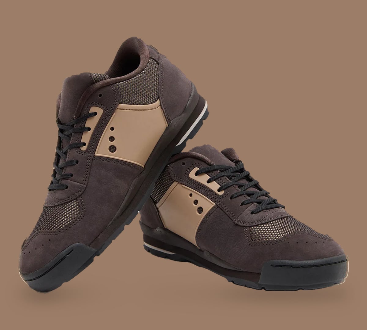 Stacked pair of brown suede sneakers, tan side panels and black laces, Nike Baltoro Low