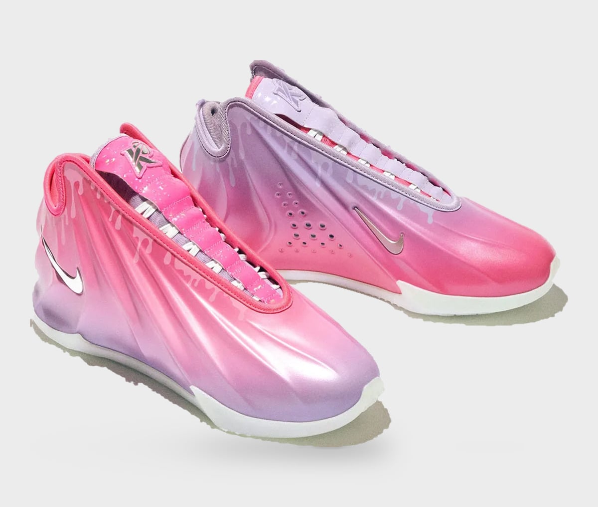Pair in pink-to-lilac gradient with draped shell upper, dripping print and chrome swoosh, Freestyle 2027 Collection