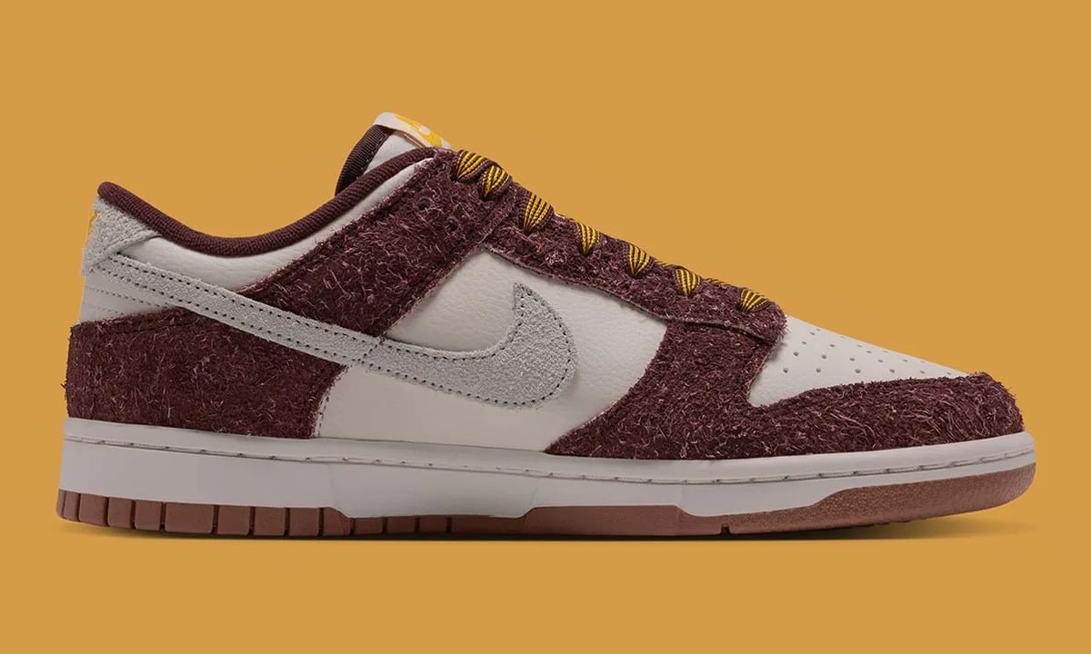 Medial view, burgundy shaggy suede, cream leather, grey swoosh and striped gold laces, Basketball Charm
