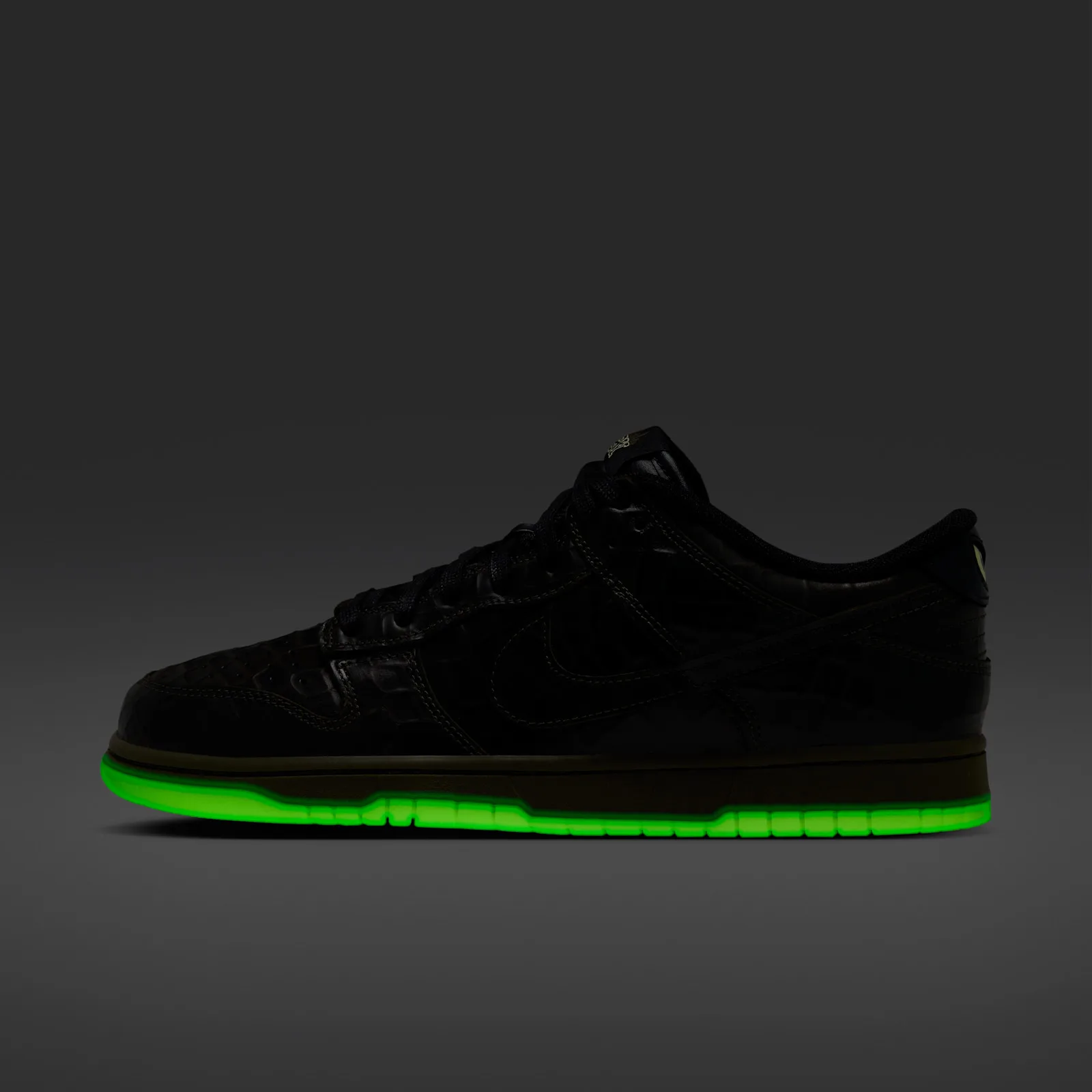 Lateral view in dim light with a bright green glowing outsole, Halloween