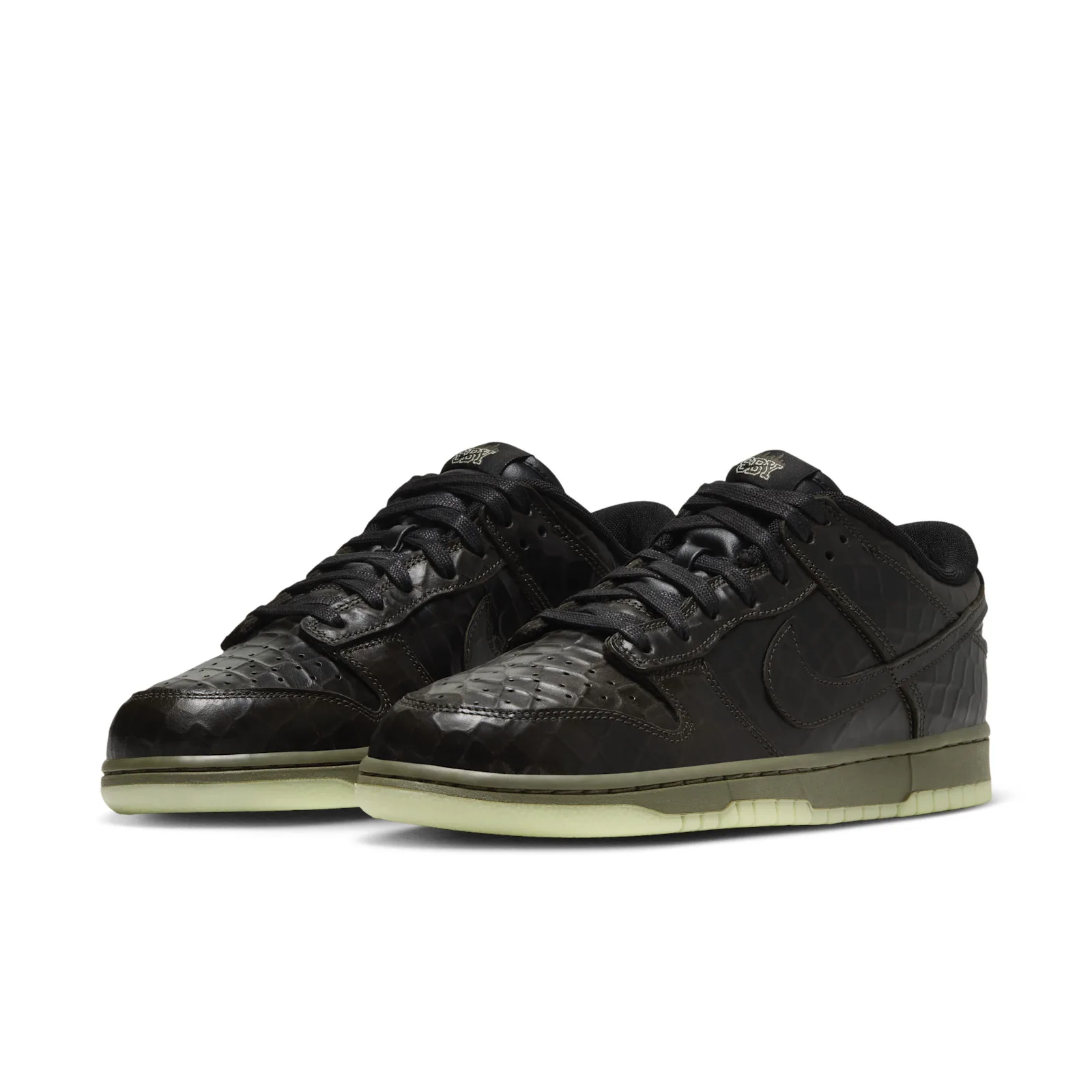 Pair at a front angle with black textured uppers and pale green outsoles, Halloween