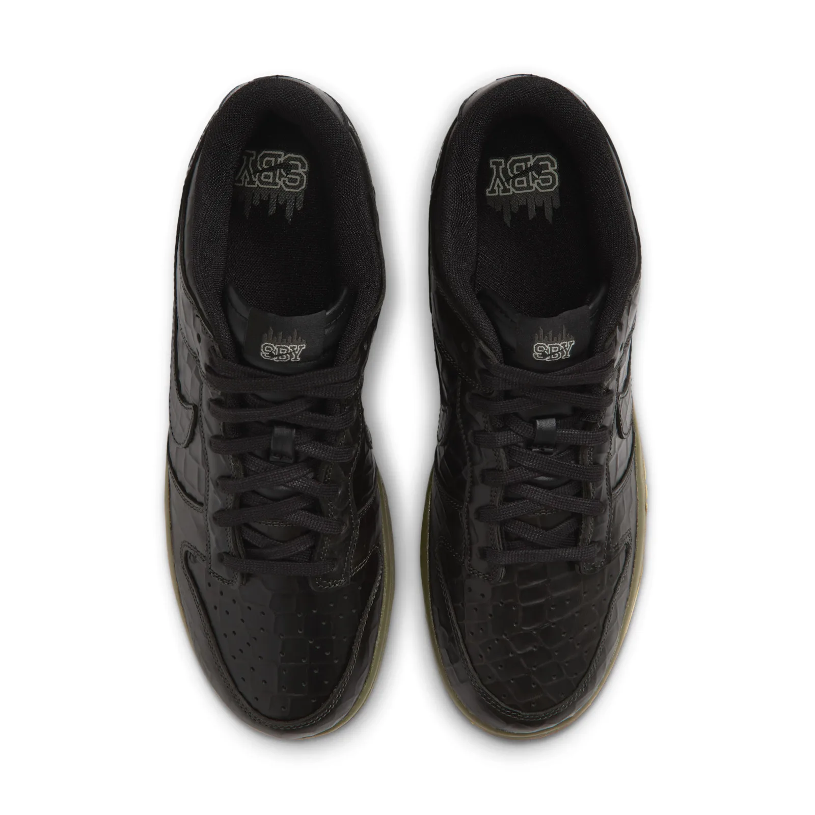 Top-down view of the pair with black laces and SBY tongue branding, Halloween