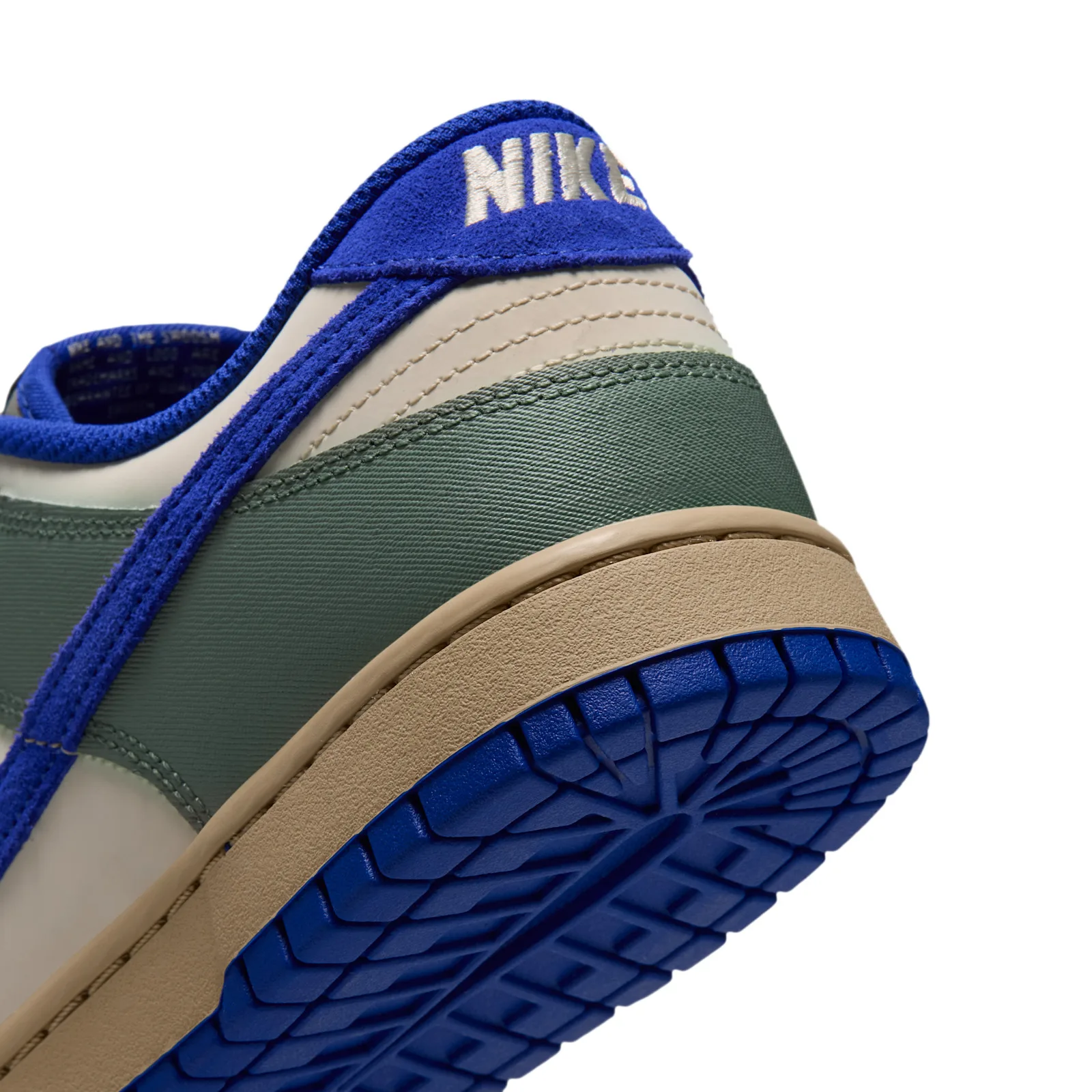 Heel detail with green woven fabric and cream Nike embroidery, Jade Stone