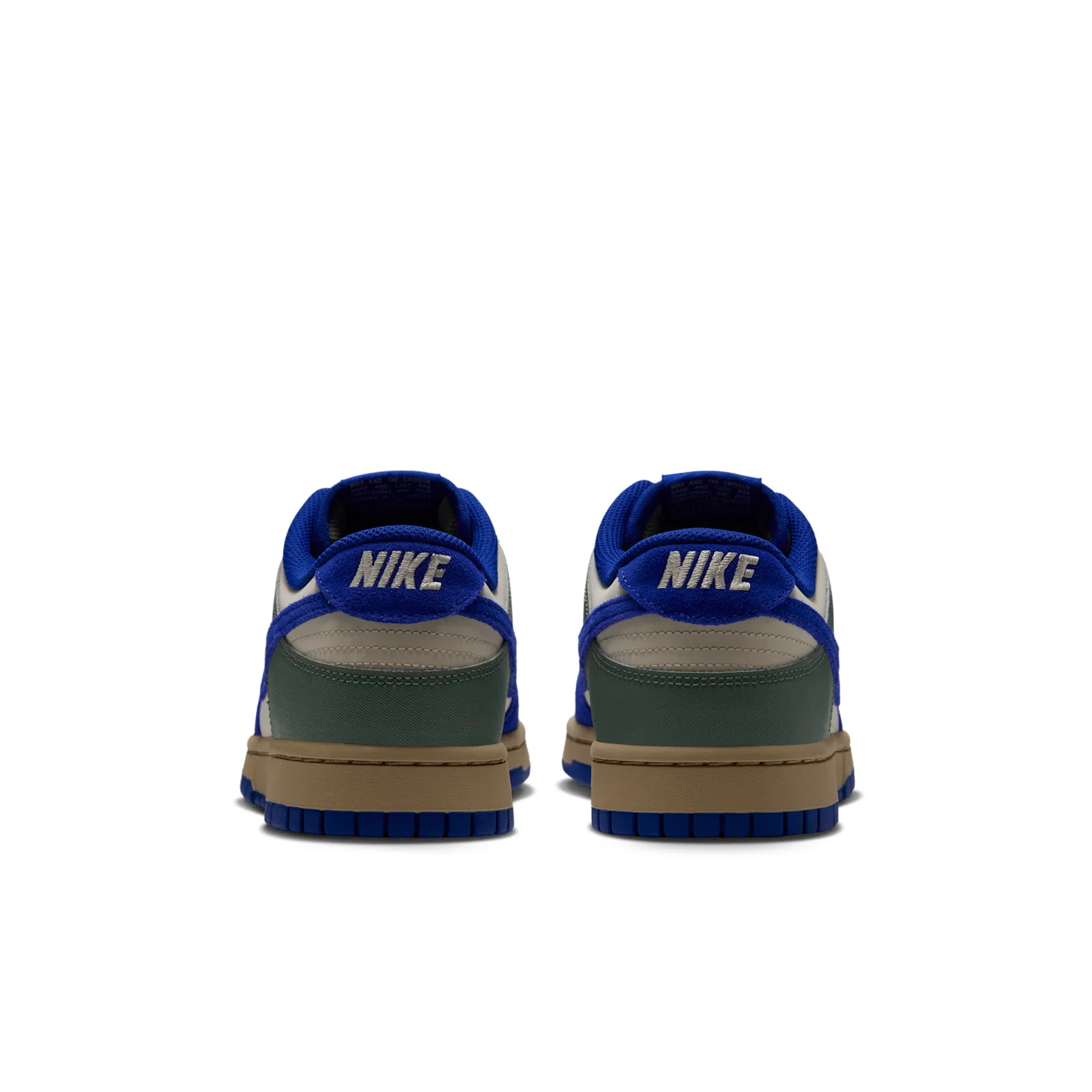 Heel view of pair with cream Nike embroidery and green panels, Jade Stone