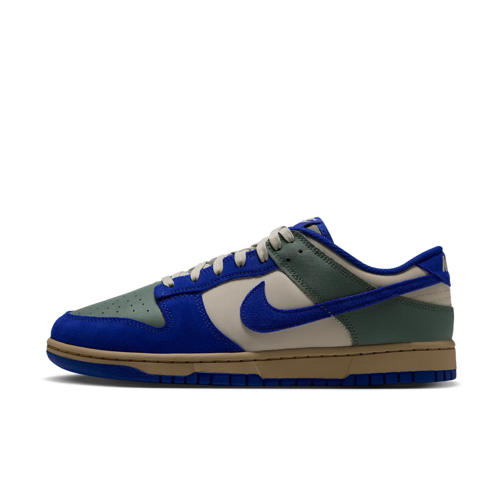 Lateral view with a blue Swoosh and tan midsole, Jade Stone