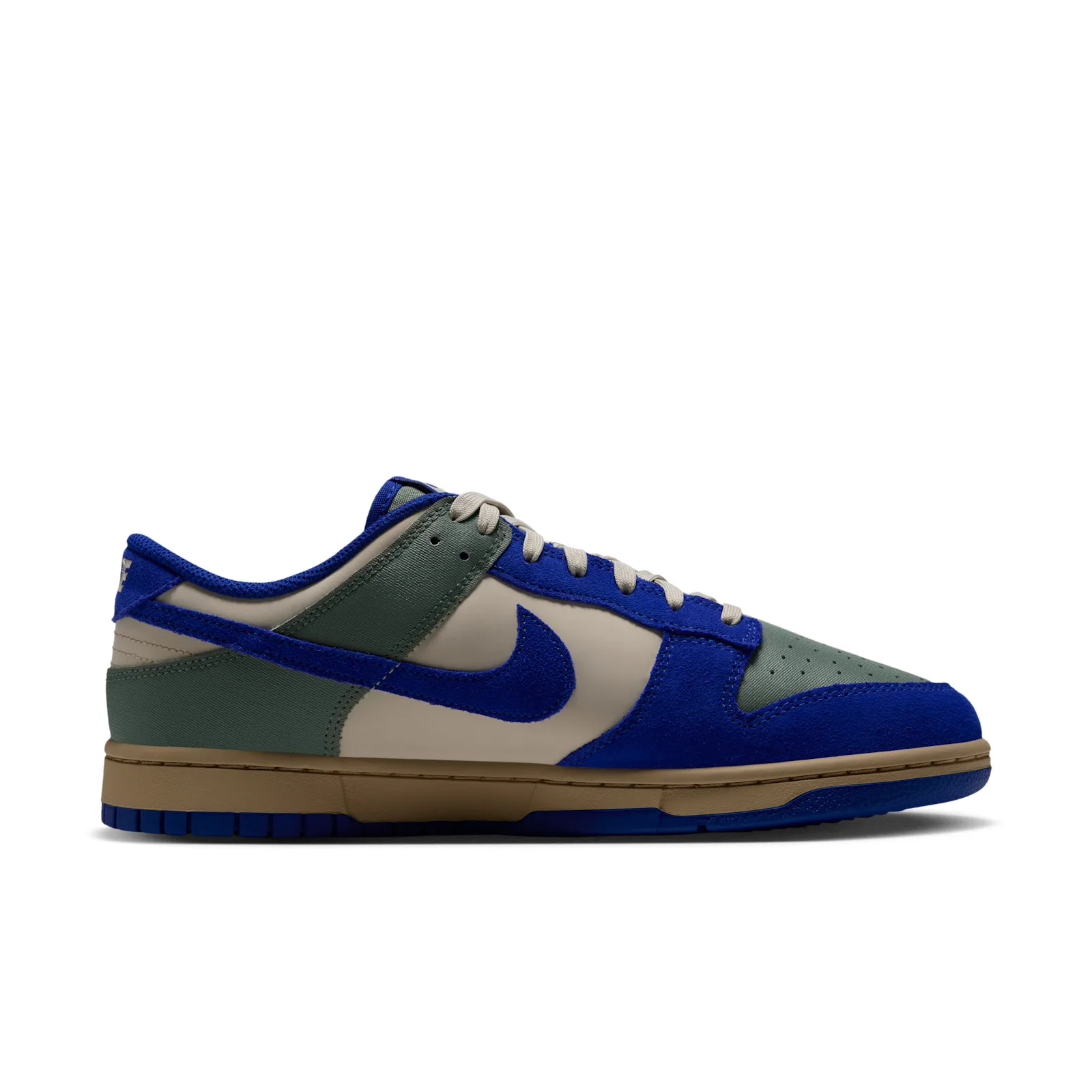 Medial view with a blue suede Swoosh and cream side panel, Jade Stone