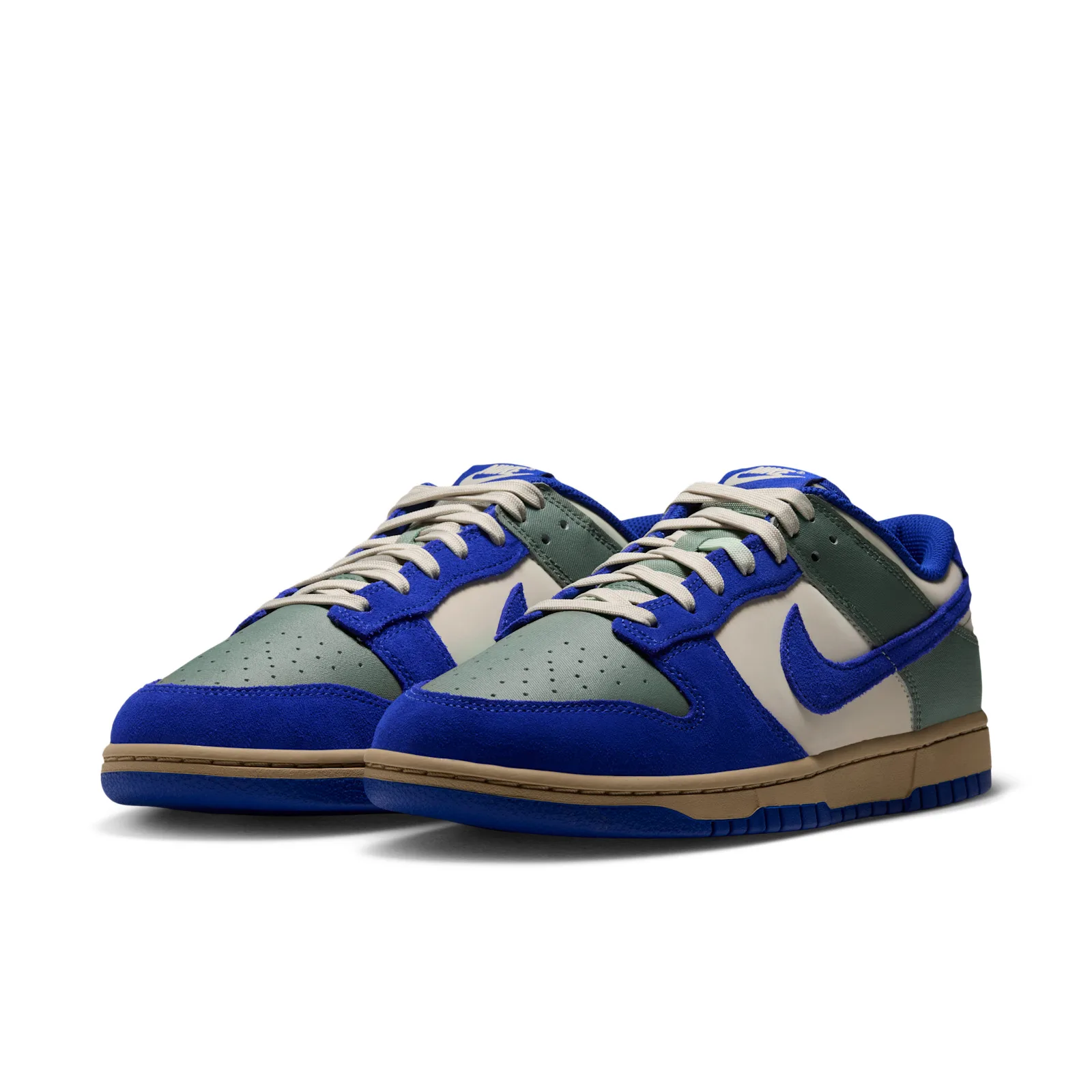 Pair at a front angle with green toe boxes and blue suede overlays, Jade Stone