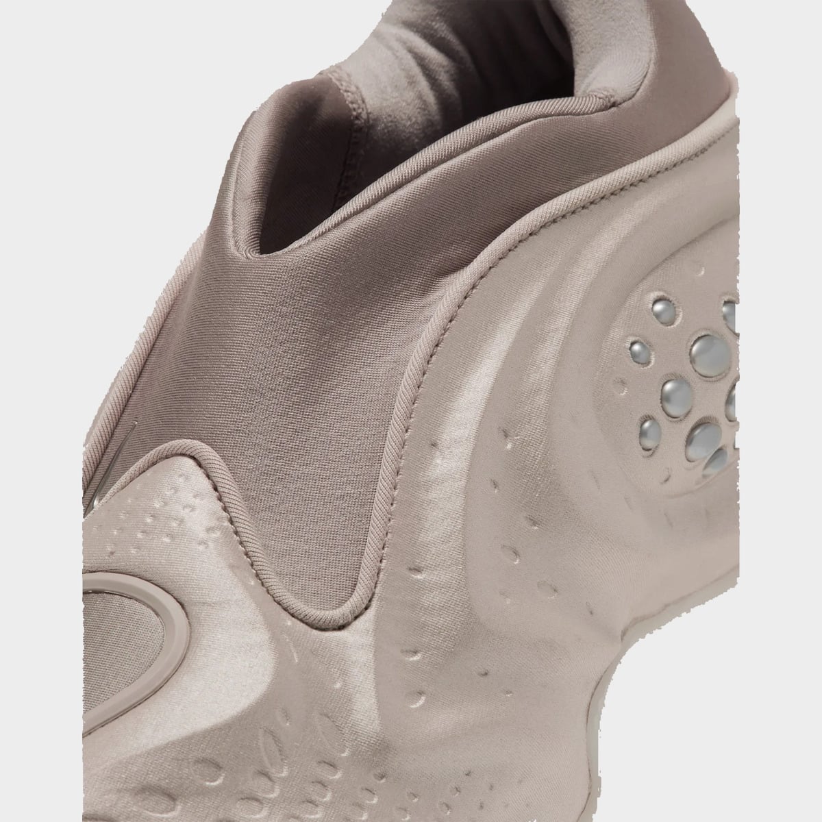 Detail of collar and forefoot, taupe stretch fabric, piped edge, embossed dimples and silver beads, Cream II