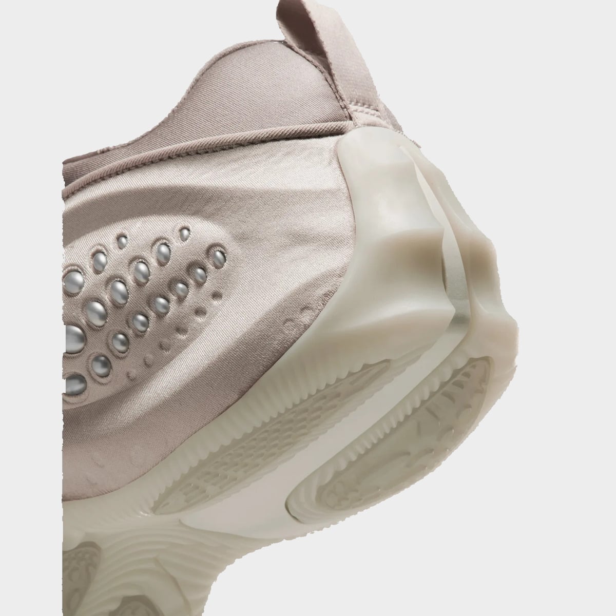 Detail of heel, silver beads on taupe satin and ridged cream translucent midsole, Cream II