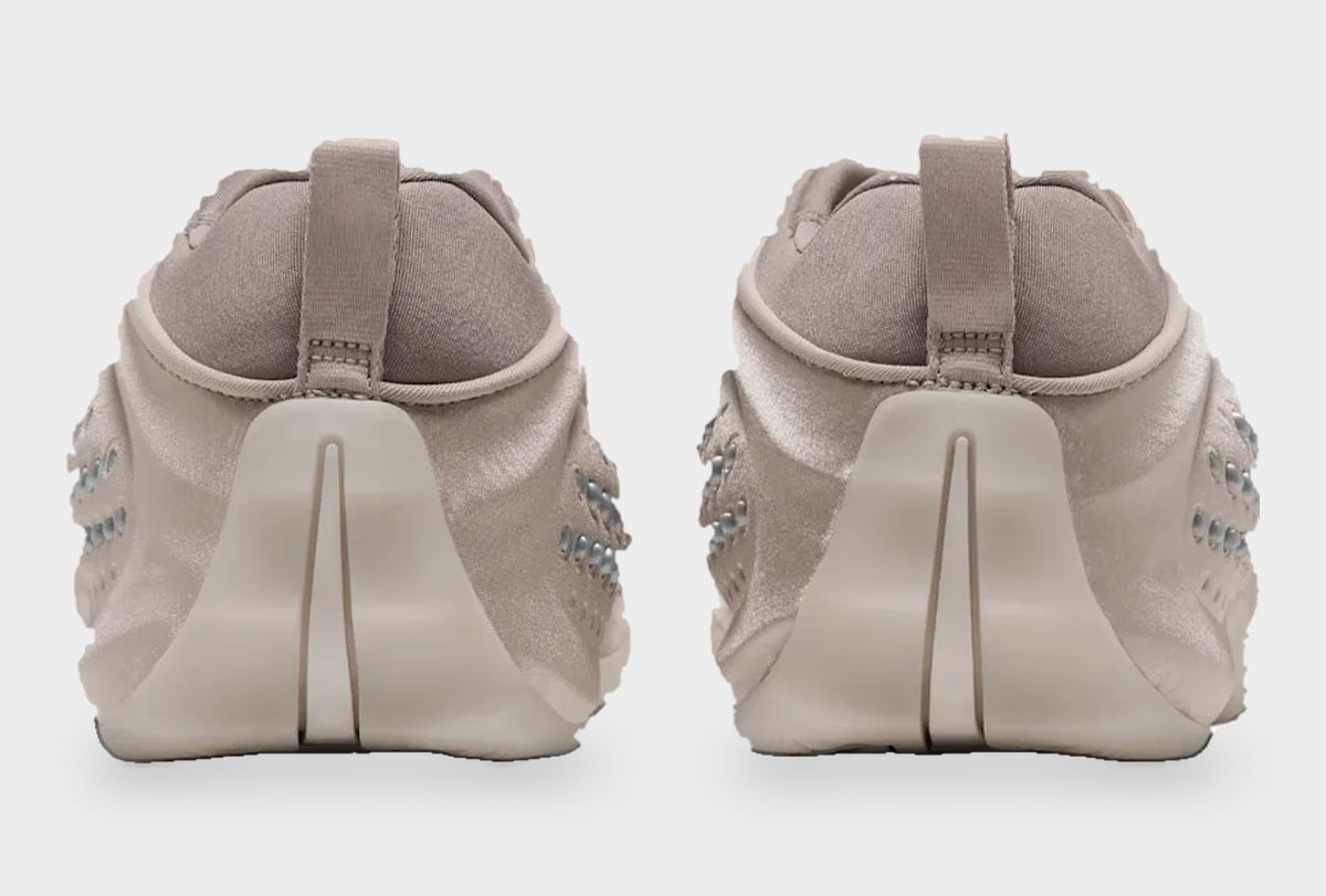 Heel view of pair, taupe pull tabs and cream sculpted heel counters with a vertical split, Cream II