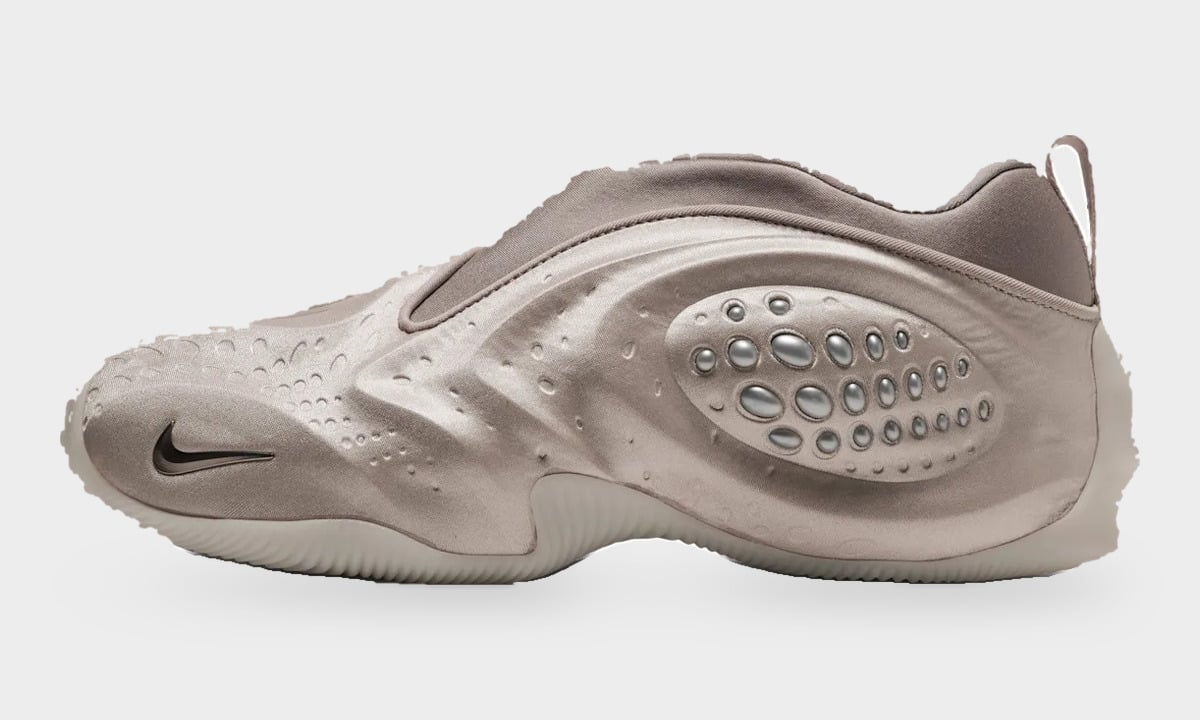 Lateral view, taupe satin slip-on with oval silver beads and black swoosh on the toe, Cream II