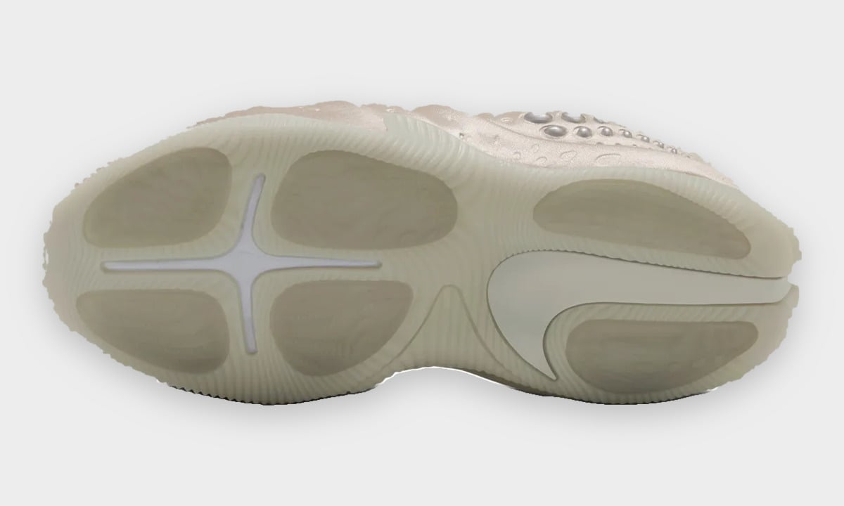 Outsole view, translucent pale green-cream rubber with oval pods, cross-shaped groove and large swoosh, Cream II