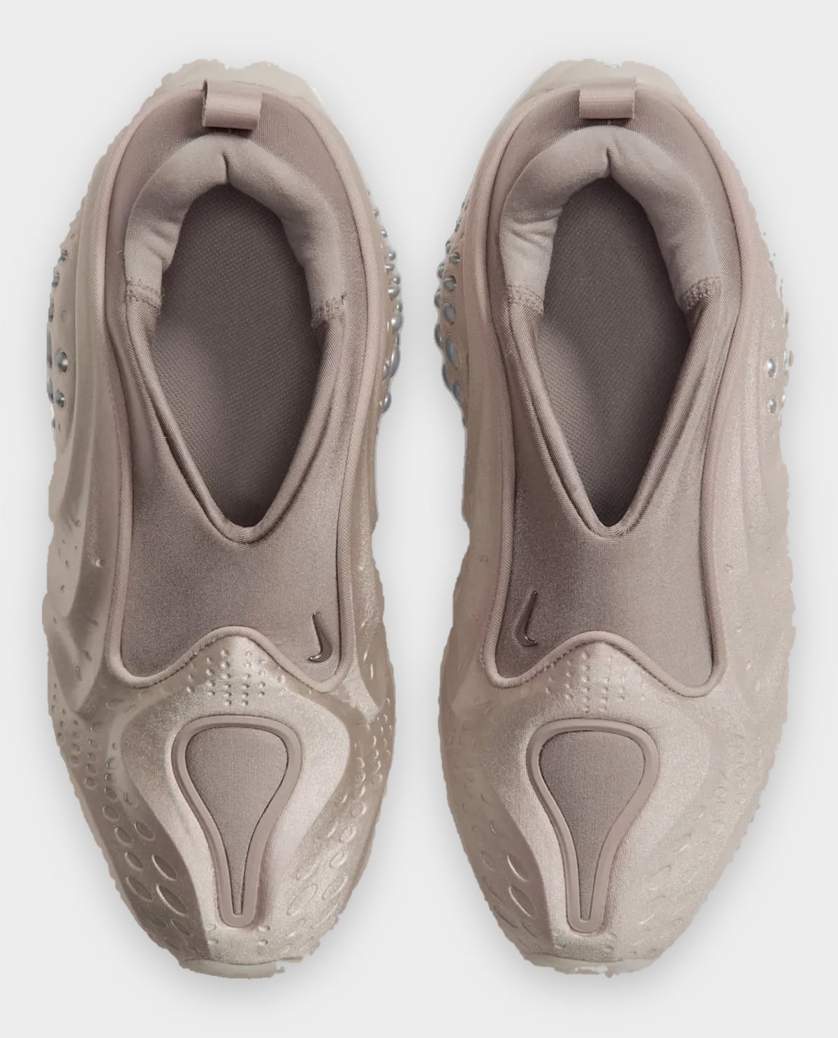 Top-down view of pair, taupe stretch collars, pull tabs, small swooshes and teardrop toe panels, Cream II