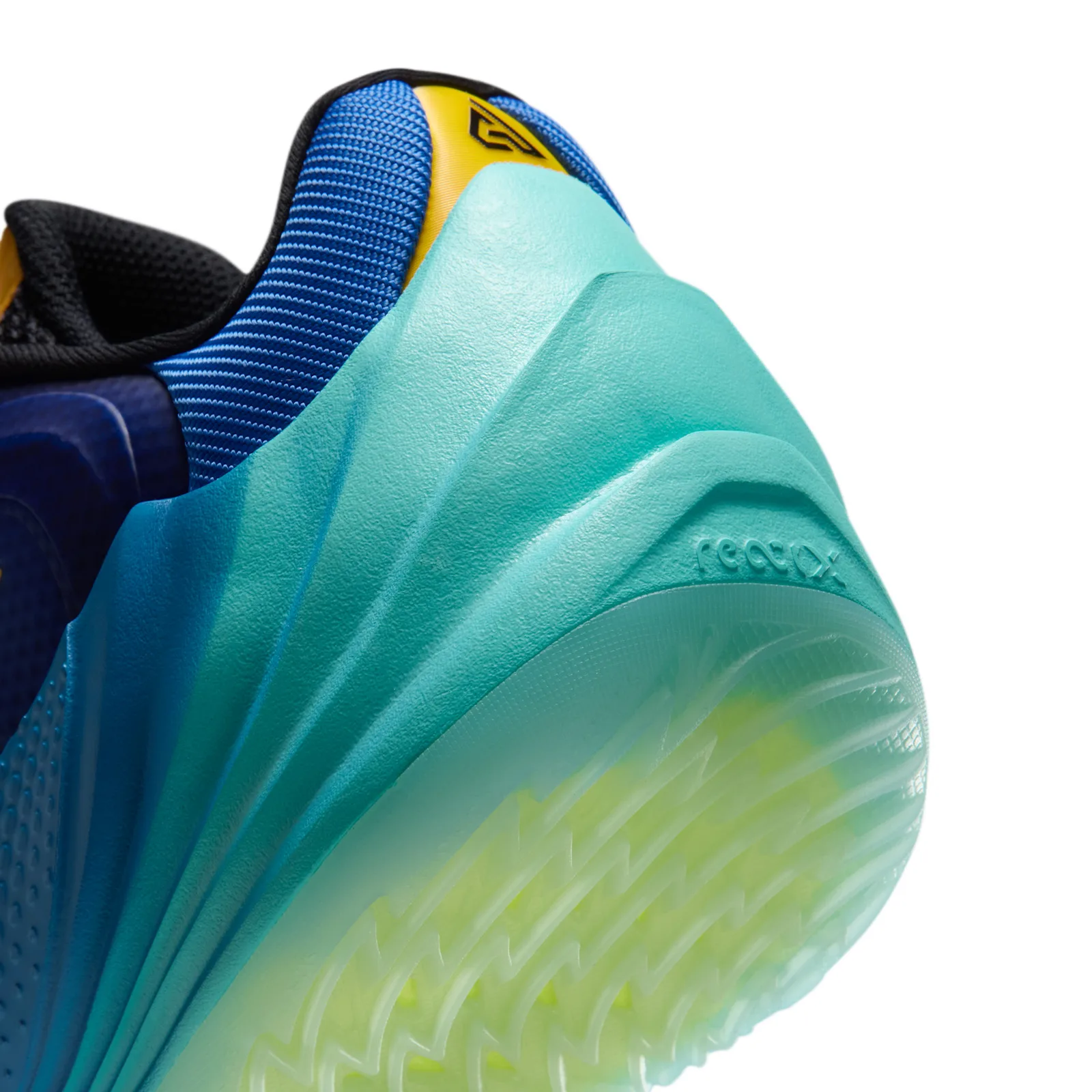 Heel detail with sculpted teal foam and embossed ReactX text, Star Blue