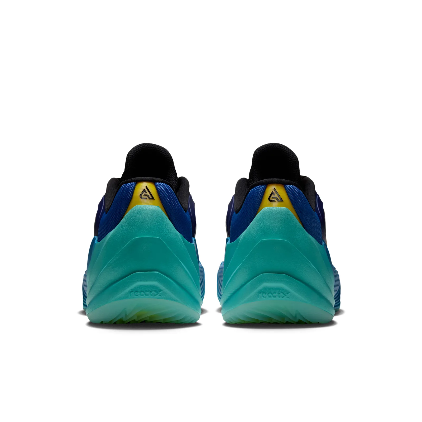 Heel view of a pair with teal sculpted soles and yellow logo panels, Star Blue