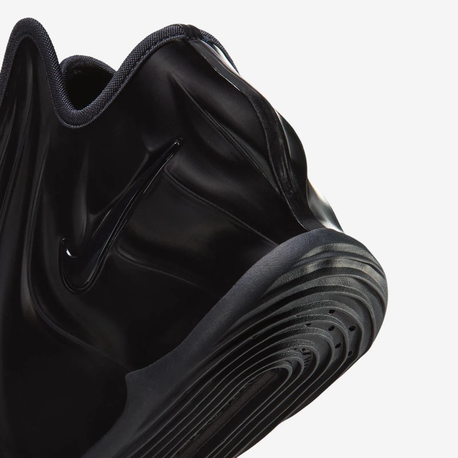 rear close-up, pull tab, ribbed collar lining and black swoosh, white background, Triple Black