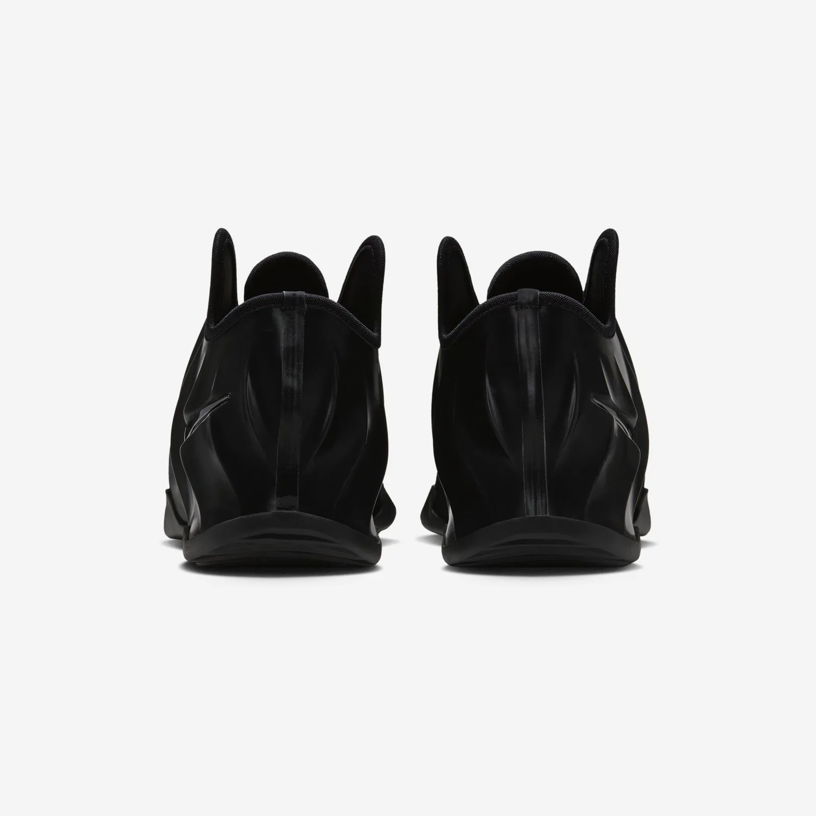 heel view of pair, pull loops and black swoosh on each heel, white background, Triple Black