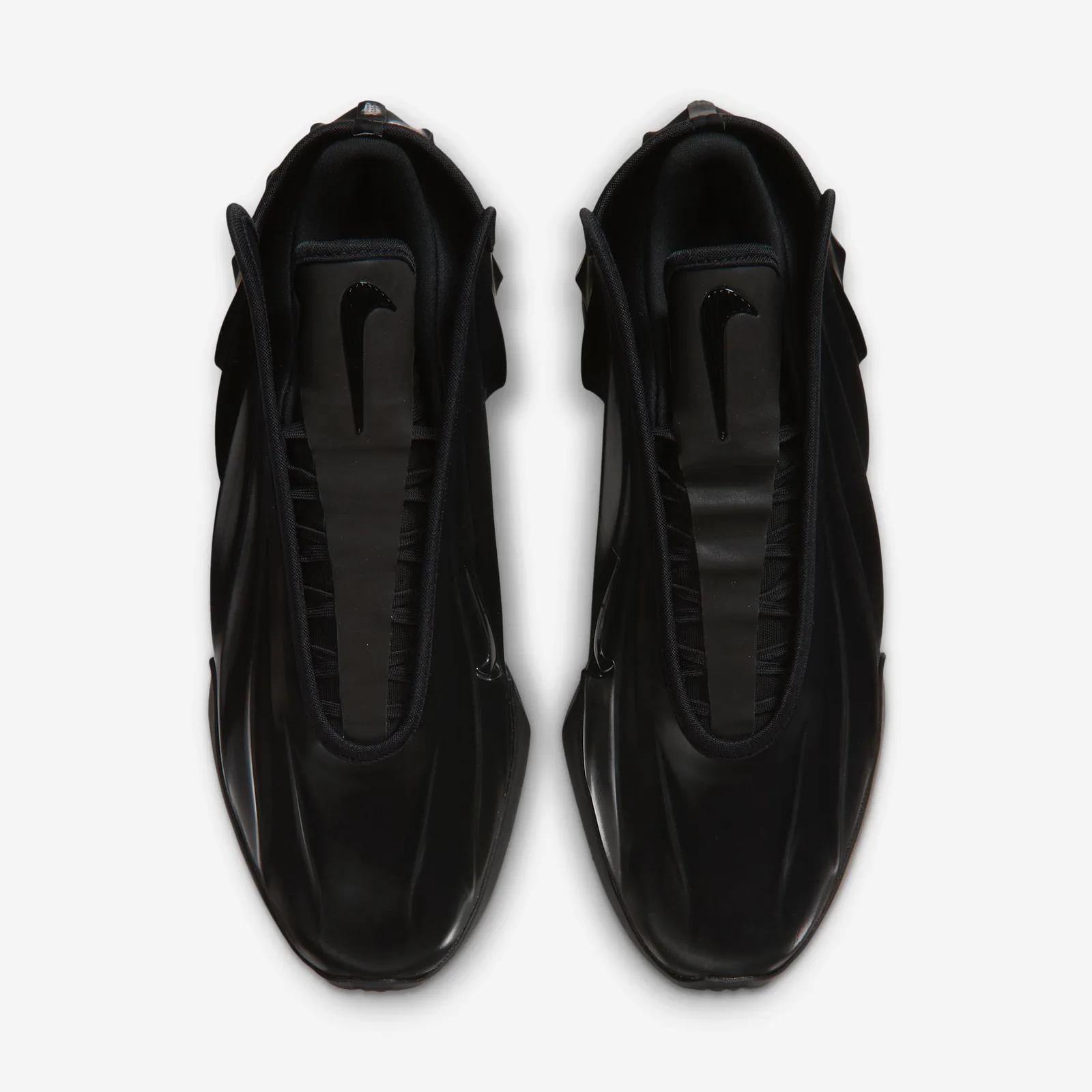top-down view of pair, ribbed tongue strap and swoosh, white background, Triple Black