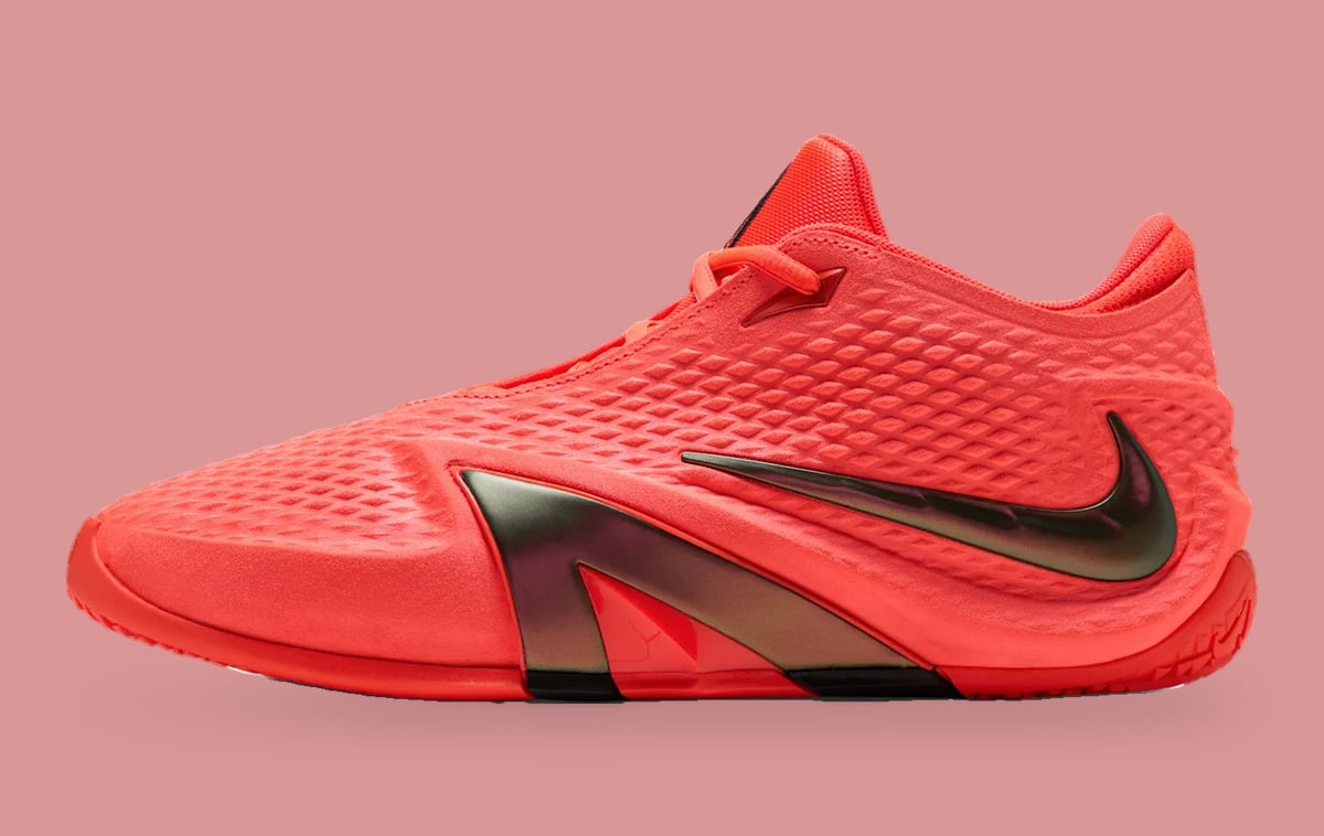 Lateral view with a coral textured upper and glossy dark Swoosh, Code Red