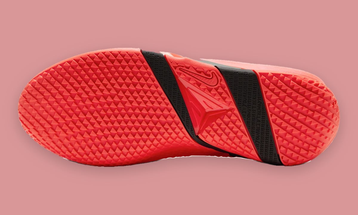 Outsole view with coral triangular tread and two black bands, Code Red