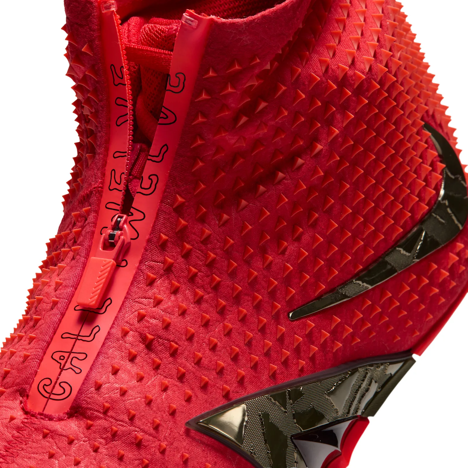 Detail of front zip with black outlined "call twelve" text, red spikes and bronze swoosh, Zombie