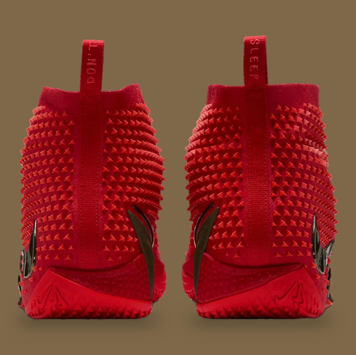 Heel view of pair with red pull tabs reading 