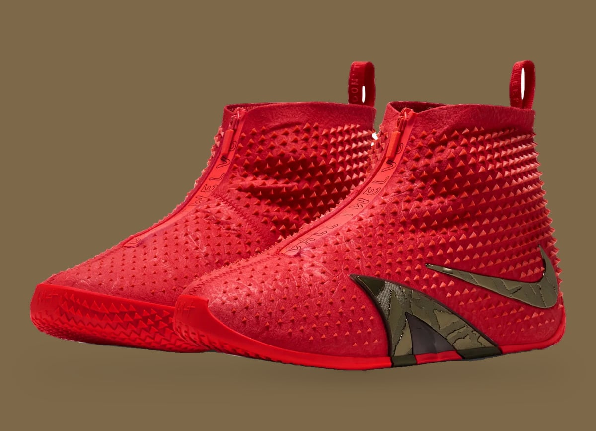 Pair, angled view of red studded high-tops with front zips, bronze swoosh and red pull tabs, Zombie