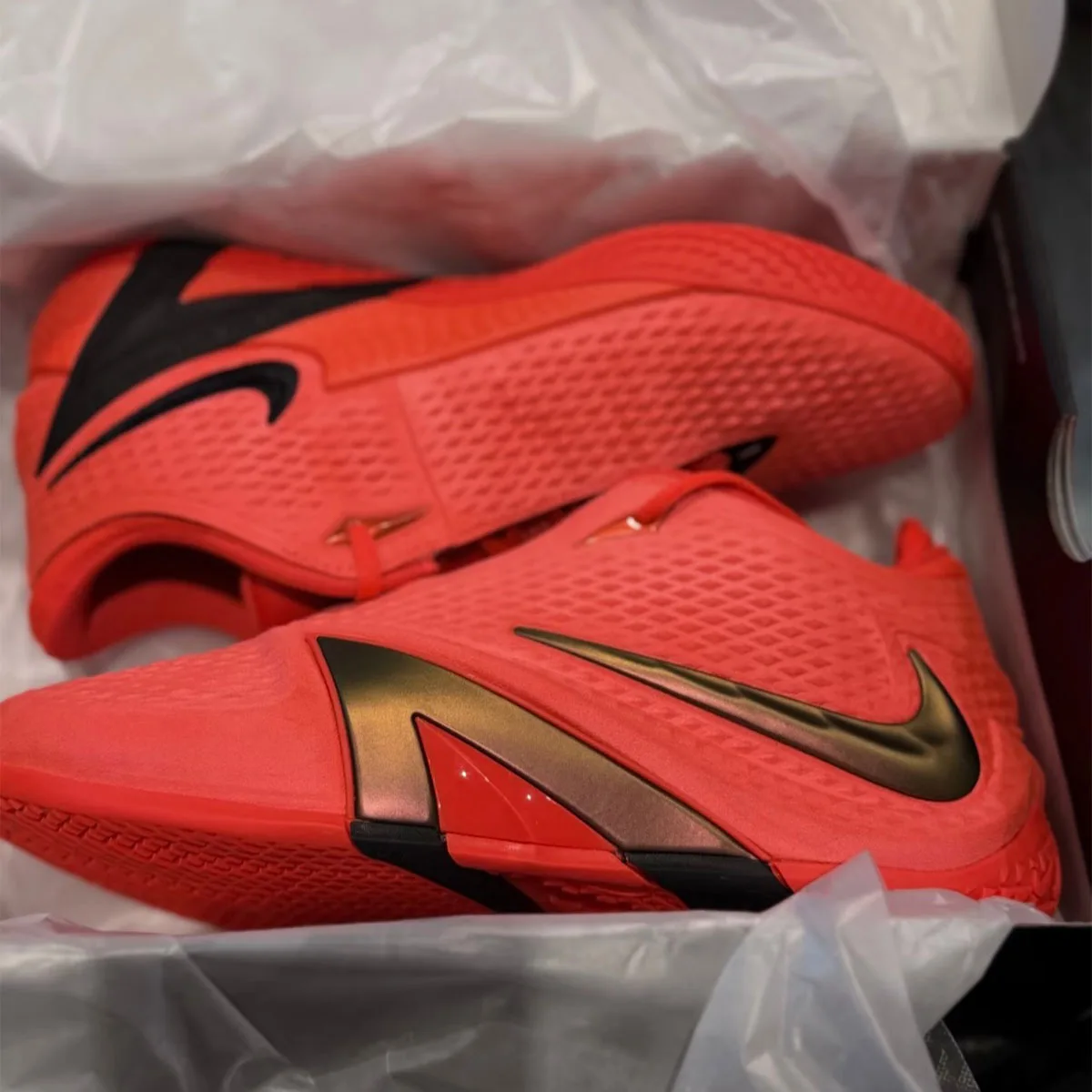 Front three-quarter view of the pair of Red Copper, Early leaked images show the standard Nike Ja 4