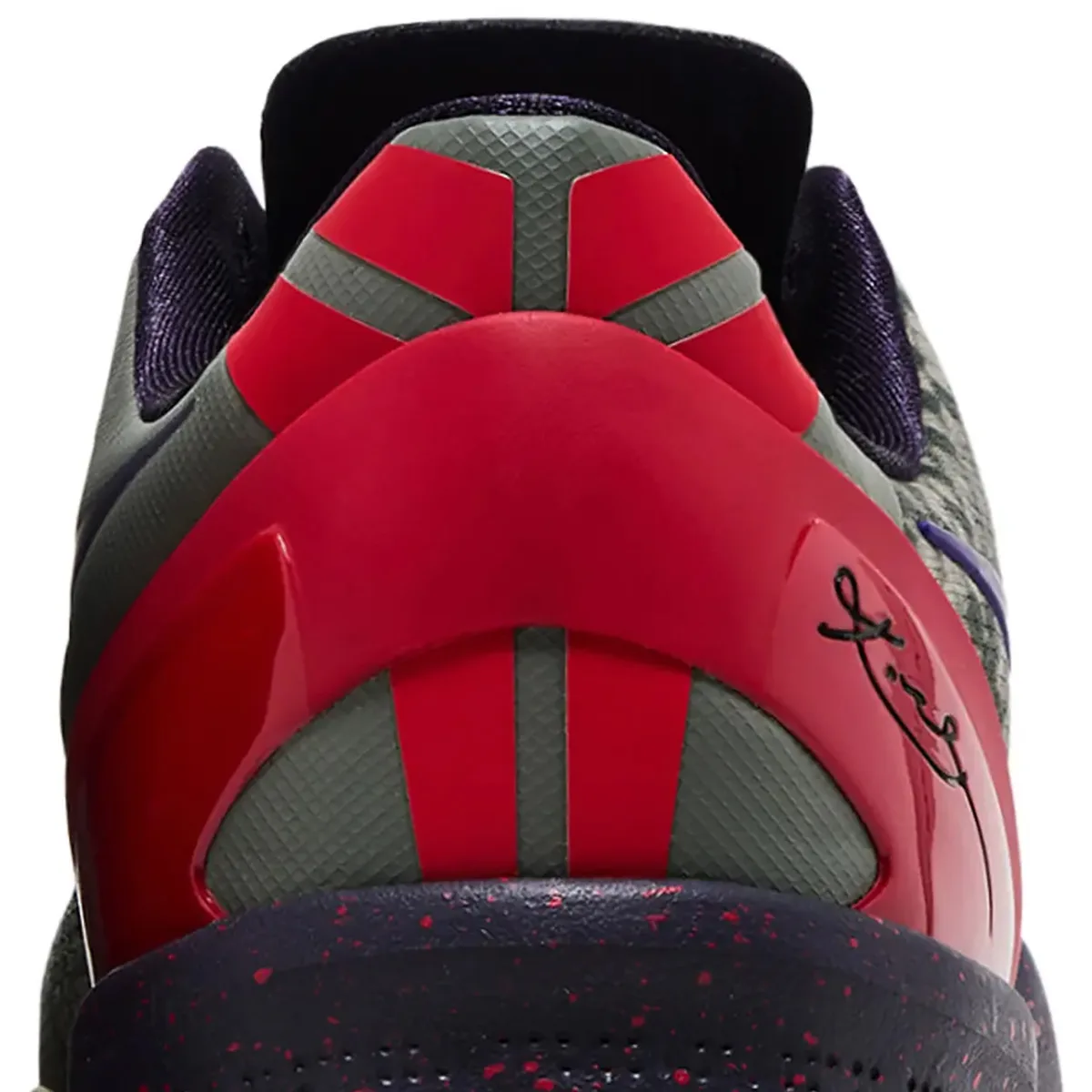 Detail of heel, glossy red clip with black signature, grey ribbed panels, speckled midsole, Mine Grey