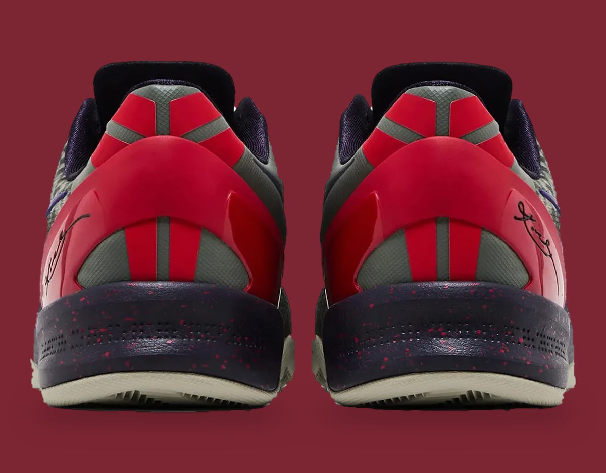 Heel view of pair on maroon, red glossy heel clip, grey panels, speckled dark midsole, Mine Grey