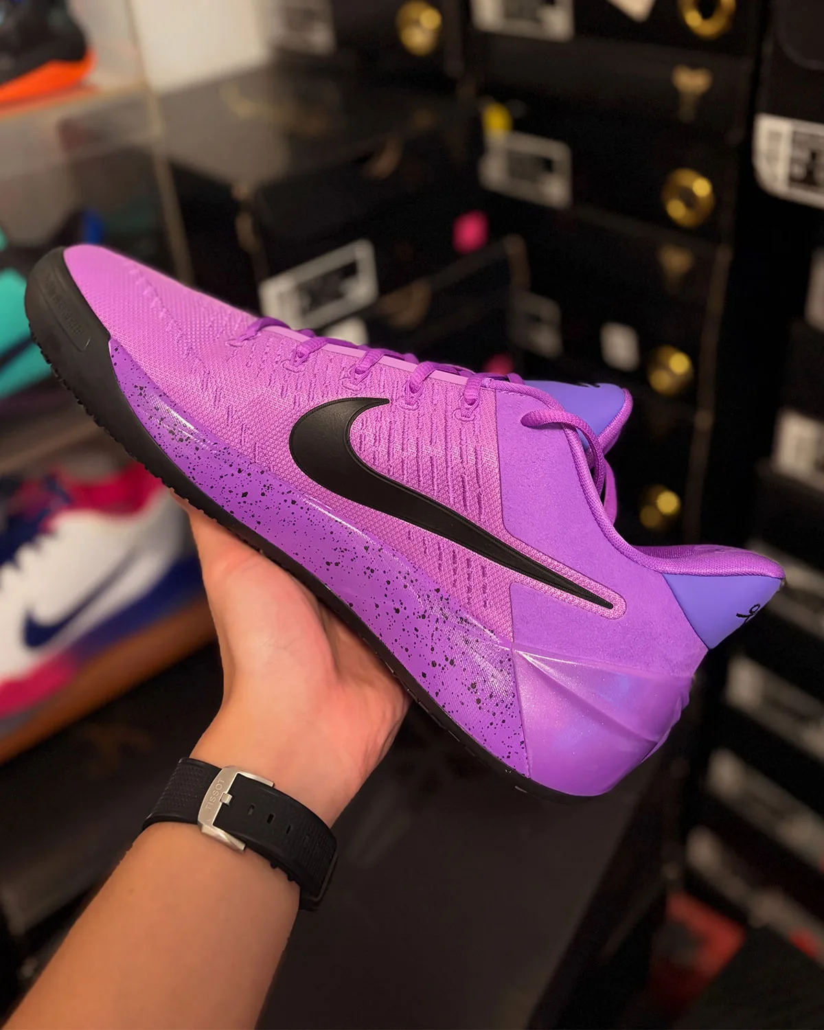 Lateral view in hand, speckled purple midsole and glossy translucent heel clip, Purple Stardust