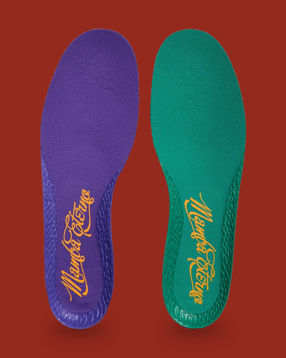 Pair of insoles, one purple and one green, with gold script lettering on red background, Mamba Eterno