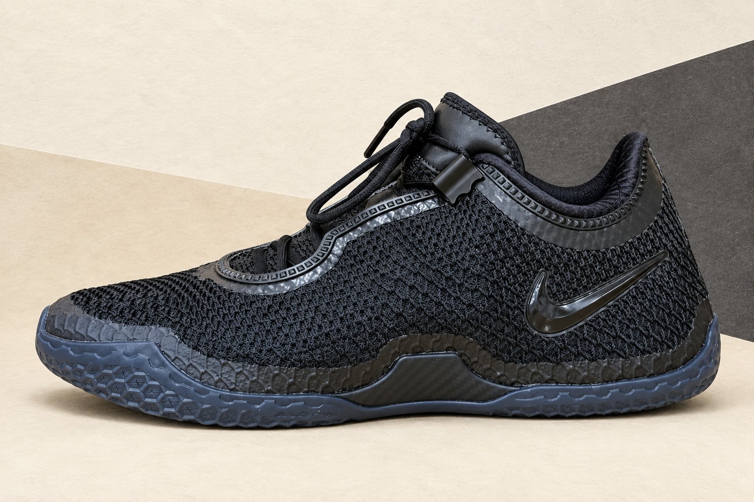 Lateral view of black mesh low-top with glossy black swoosh and slate-blue sole, Nike LeBron 24 “Black” Weartest Sample