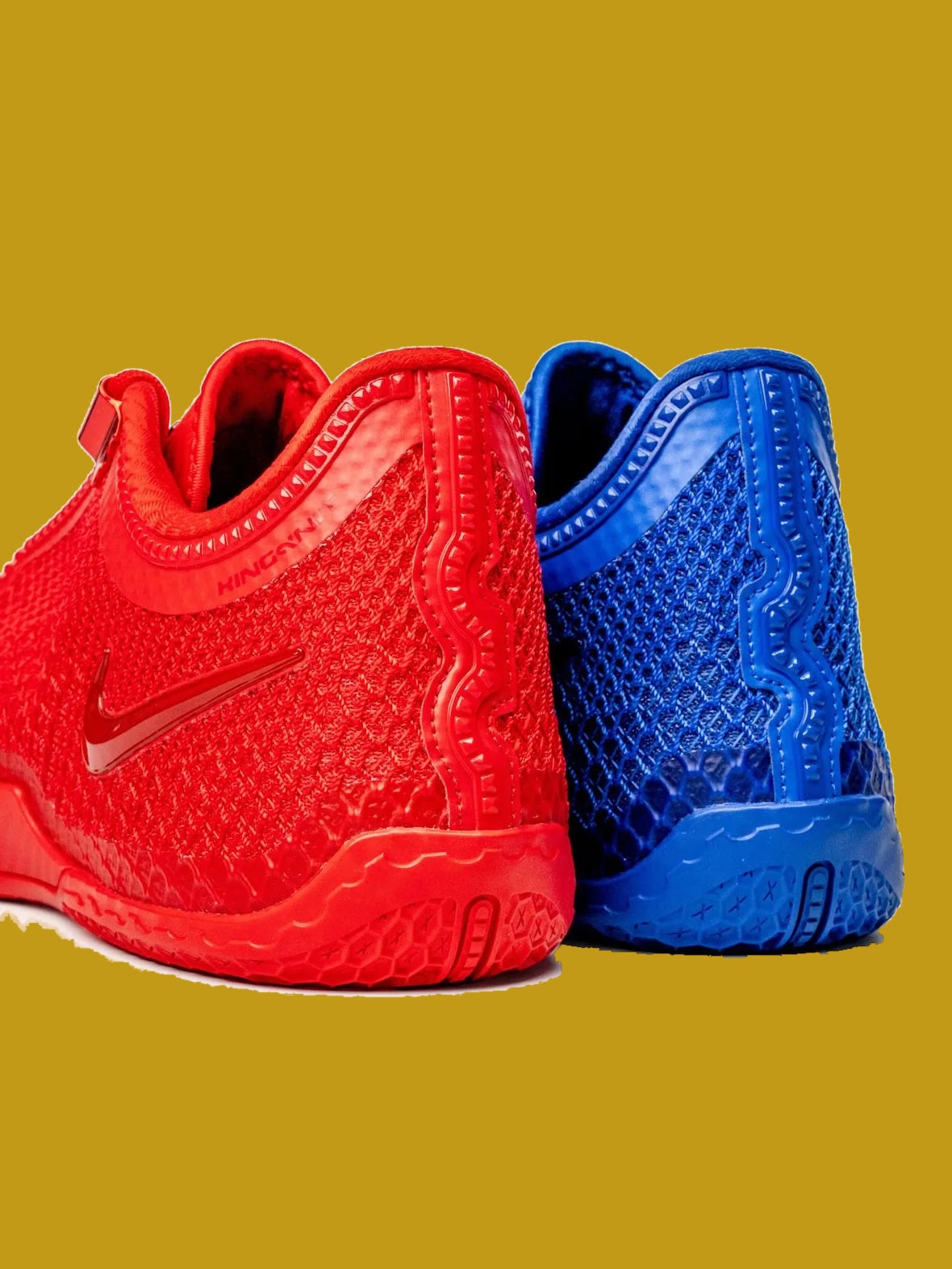Heel view of red and blue pair, textured mesh, ridged heel counter and hex outsole, Philly