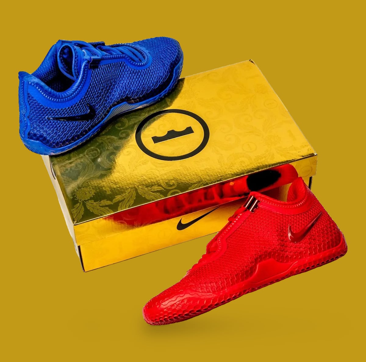 Pair on gold embossed box with crown circle logo, blue shoe above, red below, Philly