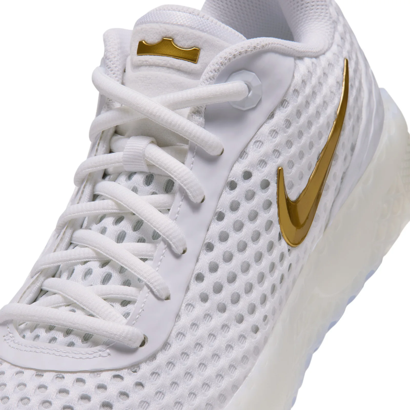 Lacing detail with white open mesh, a gold Swoosh and a gold tongue crown, White
