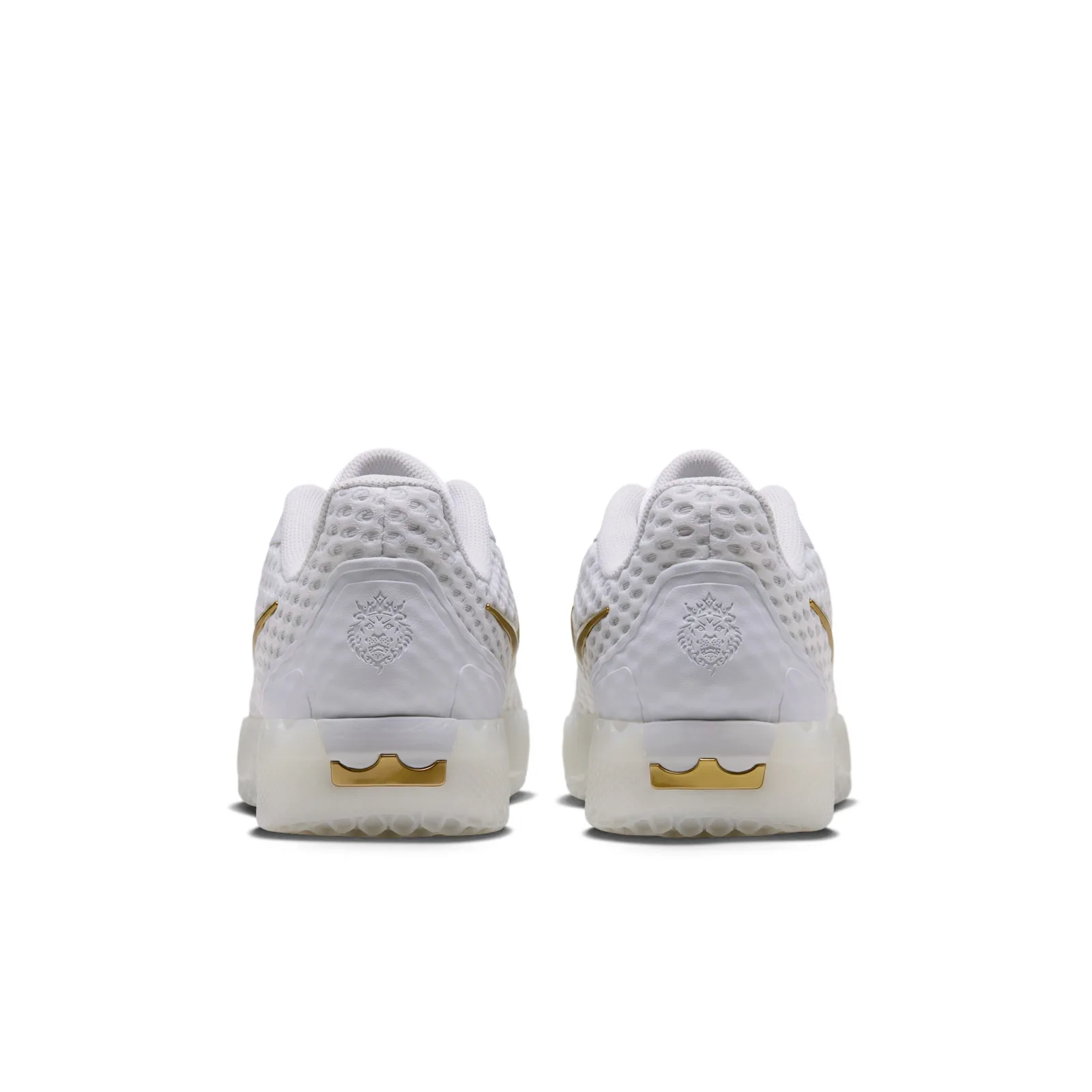 Heel view of pair with embossed lion emblems and gold crown logos, White
